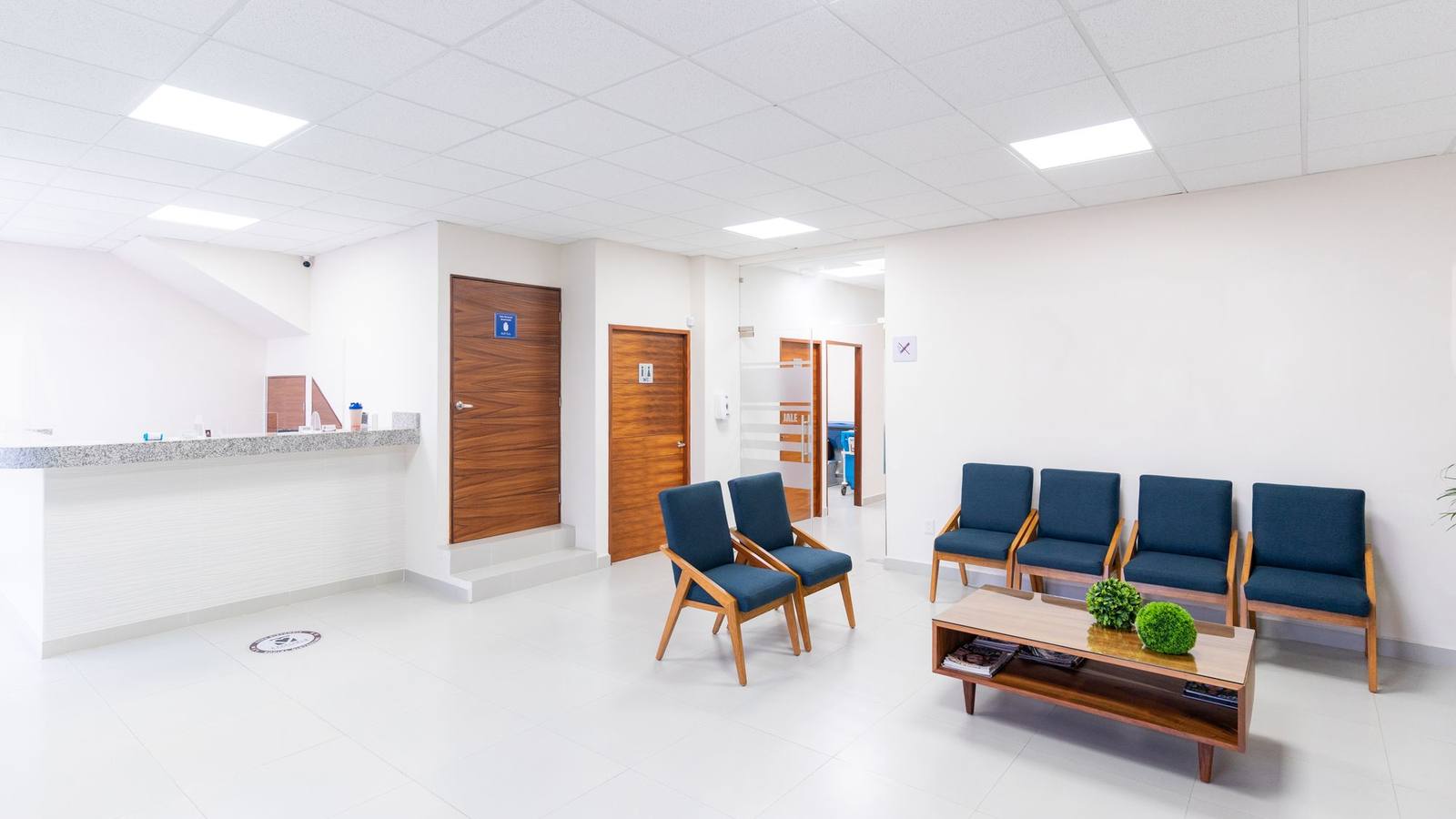 A bright, clean medical waiting room with modern seating.