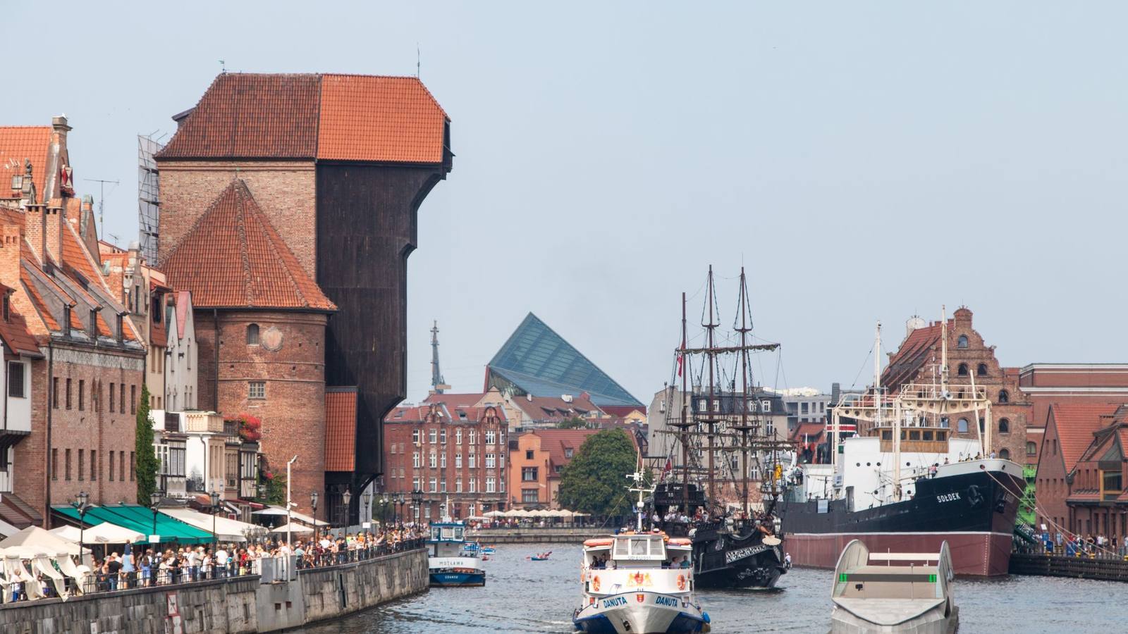 The historic crane and waterfront buildings along the Motlawa river in Gdansk.